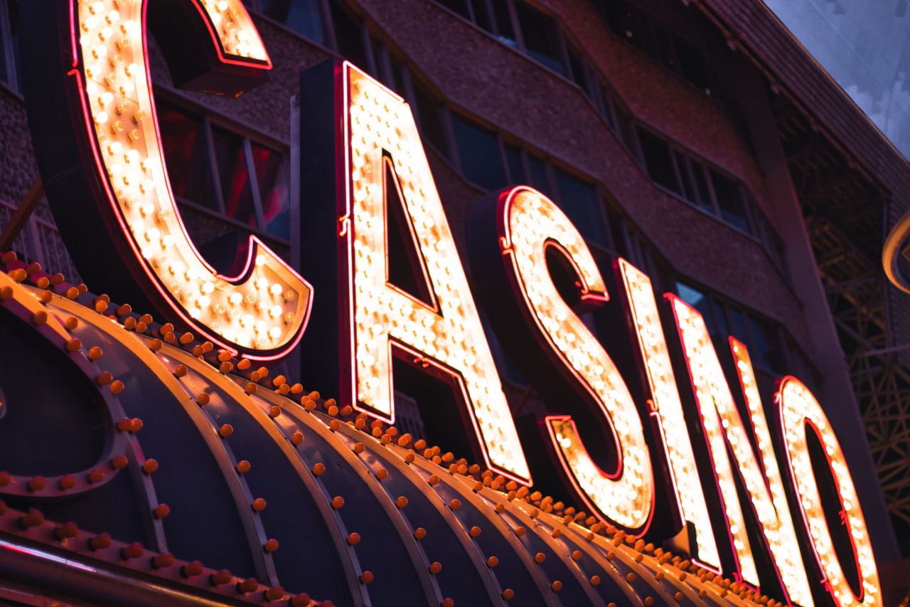 why-choose-us Brightly illuminated casino sign in Las Vegas, capturing the city's vibrant nightlife atmosphere.