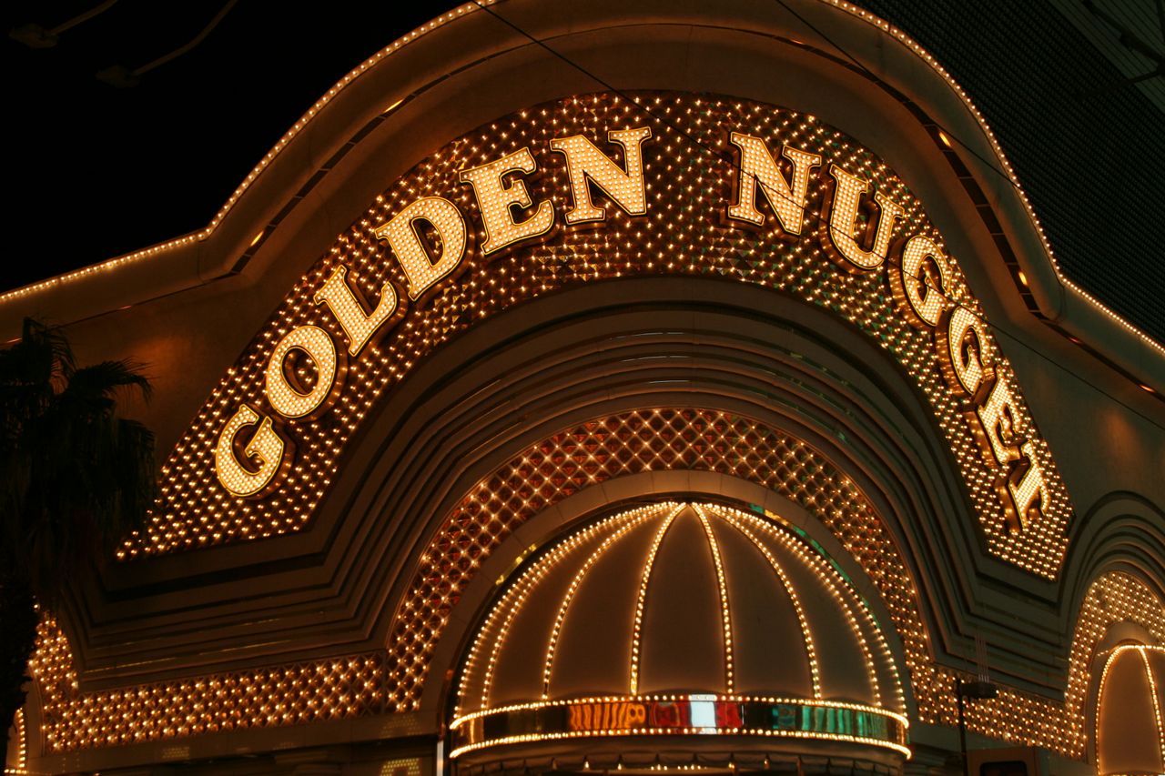 gallery-3 Iconic Golden Nugget casino entrance with bright lights at night in Las Vegas.